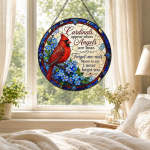 Round stained-glass panel with a red cardinal and blue flowers