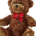 Brown teddy bear with a red bow tie on a white background