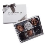 Box of assorted chocolates with a ribbon bow