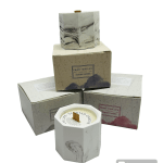 Set of scented candles in hexagonal containers with matching boxes