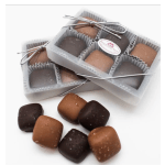 Boxes of assorted chocolate truffles tied with silver ribbon