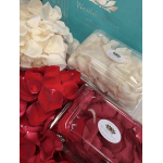 Boxes of red and white rose petals with a florist label