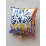 Square birthday balloon with candles and colorful lettering
