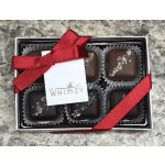 Box of chocolate truffles tied with a red ribbon