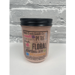 Pink candle in a glass jar with a black lid