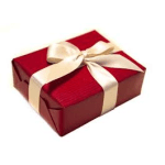 Red gift box wrapped with a cream ribbon and bow
