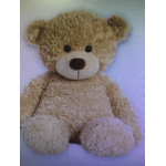 Plush teddy bear with tan fur and a white muzzle