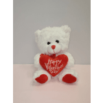 White teddy bear holding a red heart that says Happy Valentine's Day