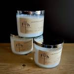 Three lavender soy candles in glass jars with metal lids