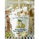 Bag of white salt water taffy with a pina colada label