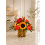 Sunflower and rose arrangement in a square amber vase