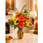 Autumn bouquet of sunflowers, gerbera daisies, roses, and green hydrangeas in a vase