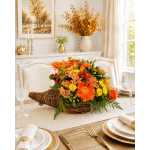 Autumn floral centerpiece in a wicker basket on a dining table