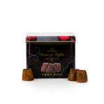 Tin of raspberry truffles with several chocolates in front