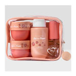 Peach-colored beauty gift set in a clear zip pouch