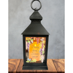 Black lantern with a memorial candle and butterfly design