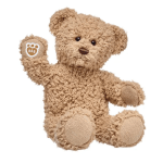 Tan teddy bear plush toy with one paw raised