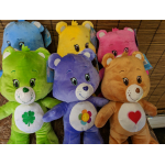 Colorful teddy bear plush toys with embroidered belly symbols