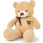 Tan teddy bear with a brown ribbon and heart patch