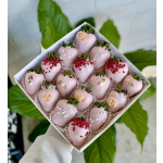 Box of pink chocolate-covered strawberries with decorative toppings