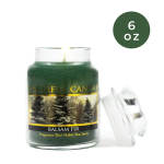 Green balsam fir candle in a glass jar with a lid