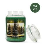 Green jar candle labeled Balsam Fir with a clear lid
