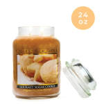 Jar candle labeled gourmet sugar cookie with a glass lid