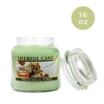 Green scented candle in a glass jar with a lid