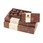 Stacked boxes of assorted chocolates with one open tray