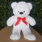 White teddy bear with a red ribbon bow