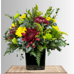 Bouquet of burgundy and yellow chrysanthemums in a black vase