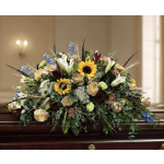Large casket spray with sunflowers, lilies, and roses