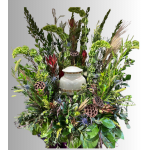 Large floral funeral spray with a white urn in the center
