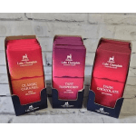 Three boxes of Lake Champlain chocolates in caramel, raspberry, and dark chocolate