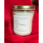 Scented candle in a glass jar with a gold lid