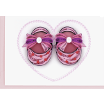 Pair of pink quilled baby shoes inside a heart outline