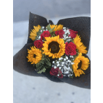 Bouquet of sunflowers and red roses wrapped in black paper
