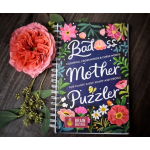 A coral flower and a spiral-bound book with floral cover art and text.