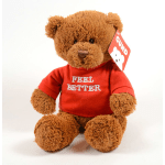 Brown teddy bear wearing a red shirt with a "Feel Better" message