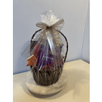 Gift basket wrapped in clear cellophane with a bow