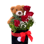 Teddy bear with red roses in a black box tied with a red ribbon