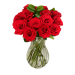 Red roses arranged in a clear glass vase