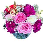 Pink and white roses with magenta carnations in a glass vase