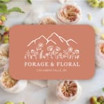 Coral florist gift card with white mountain and flower illustration over a soft floral background.