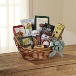 Gift basket with assorted packaged snacks and a ribbon bow