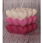 Stacked heart-shaped decorative items in pink and cream