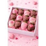 Box of chocolate-covered strawberries with pink and white drizzle