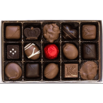 Assorted chocolates in a gift box, including a red foil-wrapped piece