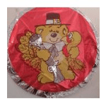 Round red balloon with a teddy bear wearing a hat and tie