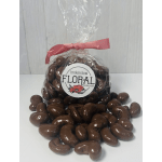 Bag of chocolate-covered nuts tied with a pink ribbon